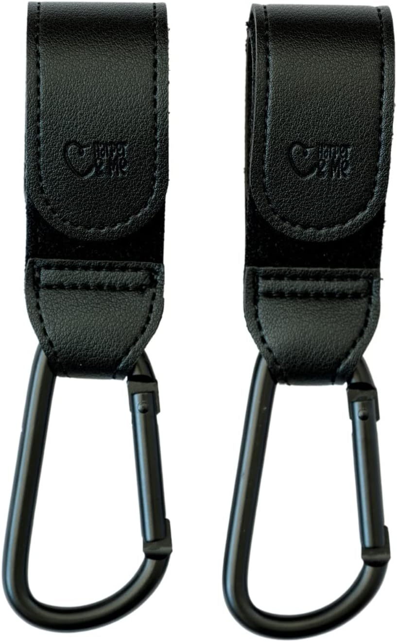 Two black straps with carabiners on a white background.
Black Harper & Me buggy clips attached to stroller handlebar – baby gear hire from Thursday’s Child Rental