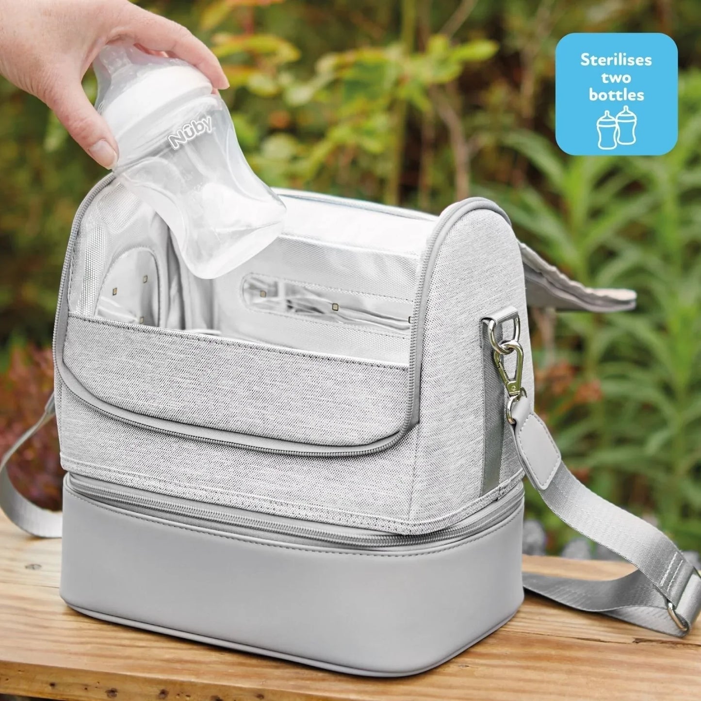 Parent using Nuby portable steriliser to clean baby bottles at home – baby bottle steriliser rental from Thursday’s Child
