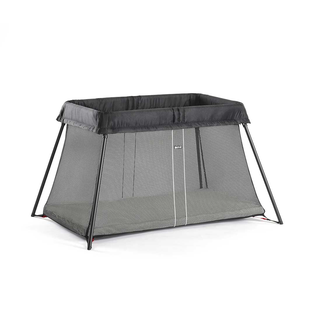BabyBjörn Travel Cot Light in black, lightweight and easy-to-fold portable crib with breathable mesh sides, available for rental