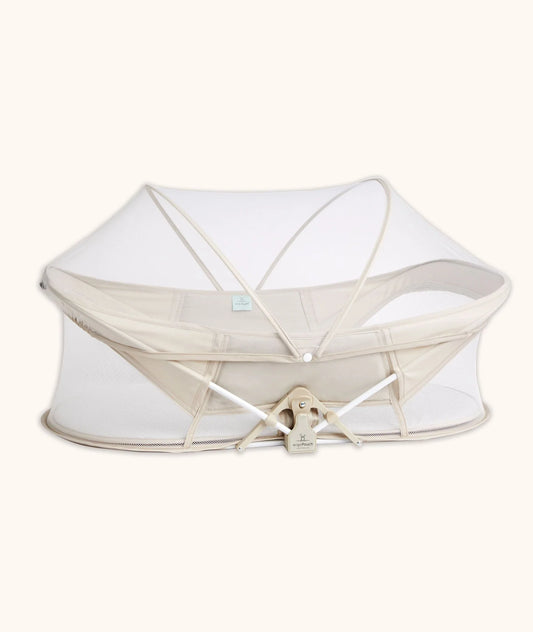 Easy Sleep Portable Crib in Ecru color – compact travel crib with breathable mesh sides.