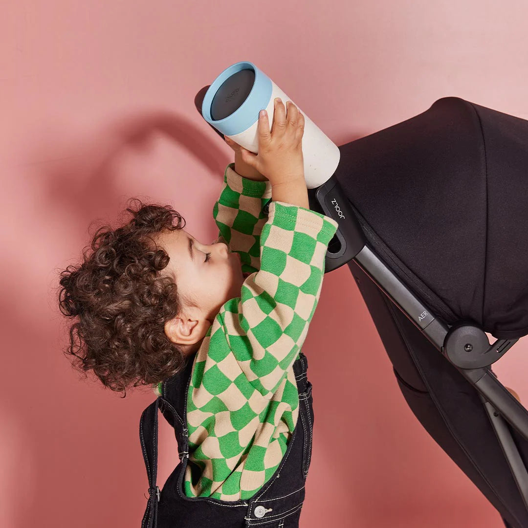 Family strolls with rented Joolz Aer stroller and cup holder from Thursday’s Child Rental.