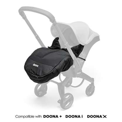 Doona Winter Cover fitted onto stroller in sleek black design.