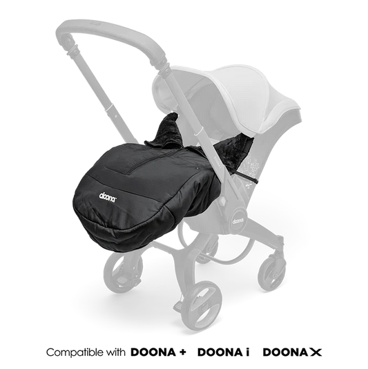 Doona Winter Cover fitted onto stroller in sleek black design.