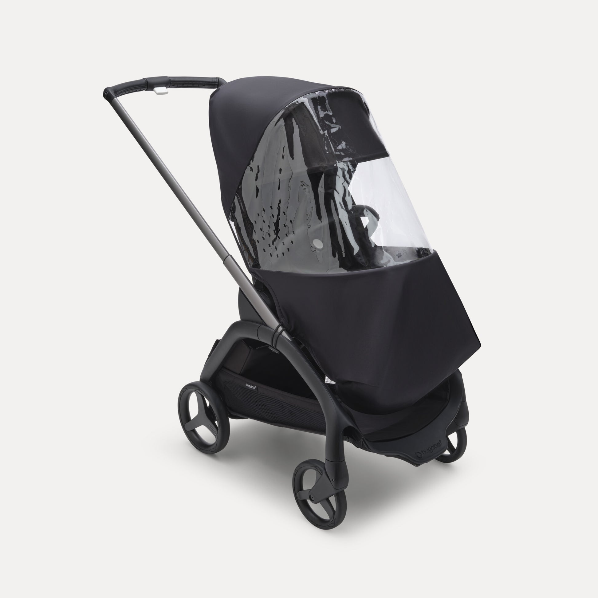 Bugaboo Dragonfly Rain Cover fitted over stroller – clear waterproof cover protecting baby from rain and wind, available to rent from Thursday’s Child Rental.