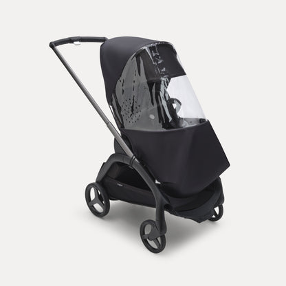 Bugaboo Dragonfly Rain Cover fitted over stroller – clear waterproof cover protecting baby from rain and wind, available to rent from Thursday’s Child Rental.