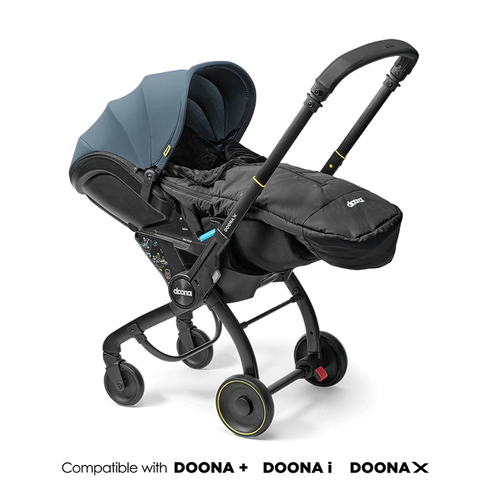 Doona Footmuff attached to stroller in sleek black design.