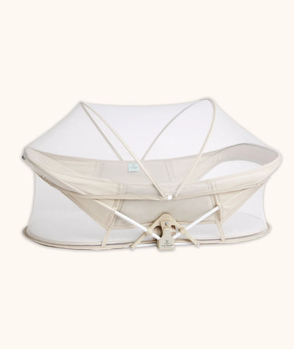 Easy Sleep Portable Crib in Ecru color – compact travel crib with breathable mesh sides.