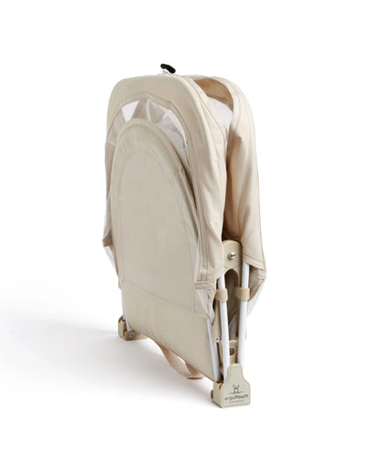 Lightweight and portable Ecru crib packed for vacation or overnight stay."
