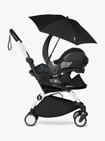 Stokke babyzen yoyo parasol in black, a sleek official parasol that easily attaches to the YOYO frame. It can be easily attached and removed, making it perfect for attaching whilst on the move and protecting your child from the sun as it protects up SPF50 Available to hire from Thursdays Child Rental. 