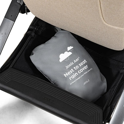 Joolz Aer+ Nest to Seat Raincover available from Thursday’s Child Rental, shown in use on stroller. Easy-fit transparent cover offering full rain protection for nest and seat modes.